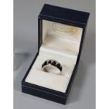 White metal stone set and black enamel dress ring marked 18K HJE. (B.P. 21% + VAT)