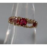 9ct gold five red stone dress ring, one stone missing. 1.6g. Size M. (B.P. 21% + VAT)