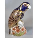 Royal Crown Derby bone china paperweight, 'Bronze Winged Parrott', in original box. (B.P. 21% + VAT)