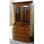 Early 20th century mahogany ships cabinet, the moulded cornice above two bevelled glazed doors,