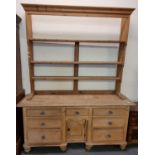 19th century pine rack back dresser, the open rack above a moulded top with an arrangement of