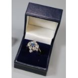 18ct gold sapphire and diamond cluster ring. 10g approx. Size S. (B.P. 21% + VAT)