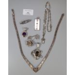 Collection of silver jewellery including: silver ingot, pendants, brooches etc. (B.P. 21% + VAT)