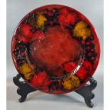 Moorcroft pottery tube lined flambe leaf and berry plate, impressed marks to the reverse. Signed.