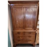 19th century oak two stage linen press, the moulded cornice above two blind panelled drawers, the