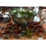 Grape and vine design carnival glass punch set comprising pedestal bowl and eleven cups. (B.P. 21% +