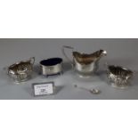 Pair of early 20th century boat shaped two handled silver salts together with a silver mustard jar