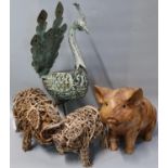 Two wicker models of pigs together with another carved wooden seated pig with glass eyes and a metal