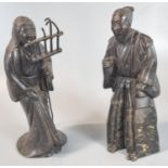 Two similar patinated bronze probably Japanese figures of Male and Female deities. 17.5cm high