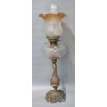 Early 20th century double oil burner lamp having orange and frosted etched glass shade above a