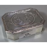 White metal, probably German, octagonal box, the top decorated with relief figures of young children