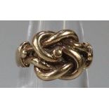 Yellow metal knot design ring. Size K1/2. 6.5g approx. (B.P. 21% + VAT)