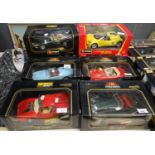 Collection of eight Burago diecast metal 1:18 scale model vehicles, all in original boxes to