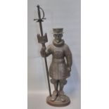 Early 20th century cast iron companion stand in the form of a Beefeater. Impressed marks 'Made in