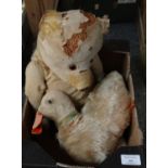 Box containing two well loved antique soft toys; a duck with felt bill and glass eyes and a teddy