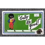 Enamelled metal advertising sign for Golden Shred 'Golly it's Good', incorporating a row of hooks.
