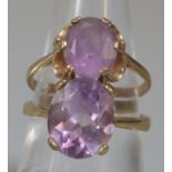 Two 9ct gold purple/lilac stone dress rings. 5.4g approx. (2) (B.P. 21% + VAT)