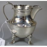 Early 20th century silver helmet shaped cream/milk jug on four hoof feet, London hallmarks. 5.9 troy