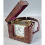 19th Century brass and enamel French carriage clock with Roman numerals in fitted original tooled