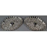 Pair of silver repoussé oval pin trays. 2.3 troy oz approx. (B.P. 21% + VAT)