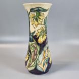 Modern Moorcroft pottery tube lined 'Comfrey' pattern vase of waisted form. 21cm high approx,
