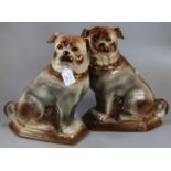 Pair of early 20th century Staffordshire Pottery seated Pug fireside dogs with glass eyes. (2) (B.P.