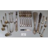 Bag of silver and silver plated flatware: spoons, forks, tongs etc. Together with a novelty bookmark