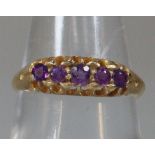 18ct gold purple five stone dress ring. Size M1/2. 2.9g approx. (B.P. 21% + VAT)