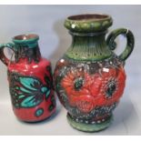 West German pottery fat lava red ground and green abstract single handled jug together with