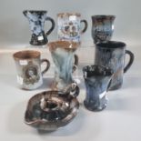 Collection of Ewenny pottery items to include: chamber stick, jugs, Queen's Silver Jubilee mug