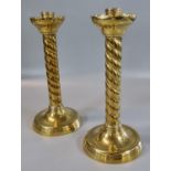 Pair of 19th Century brass twist candlesticks on circular bases. 25cm high approx. (B.P. 21% + VAT)