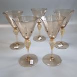 A set of five probably Venetian octagonal wine glasses. (5) (B.P. 21% + VAT)