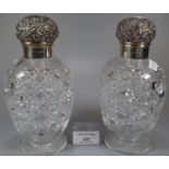 Two similar glass silver topped baluster shaped hobnail cut scent bottles, London hallmarks.