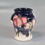 Modern Moorcroft pottery tube lined 'Wild Cyclamen' vase, dated 2001. 9cm high approx. Impressed and