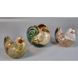 Three Royal Crown Derby bone china paperweights all with gold stoppers to include: chicken, farmyard