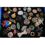 Collection of vintage and other brooches, to include: fish, millefiori, floral etc. (B.P. 21% + VAT)