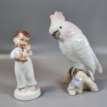 Royal Dux porcelain model of a parrot in pink and pastel tones, perched on a naturalistic base.