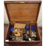Early 20th century wooden oak box, the interior revealing assorted coinage: GB and Foreign, some
