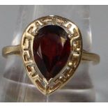 14ct gold coloured red pear shaped stone dress ring. Size S. 3.9g approx. (B.P. 21% + VAT)