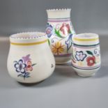 Three Poole pottery hand painted floral and foliate vases. (3) (B.P. 21% + VAT)