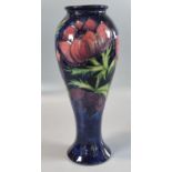 Modern Moorcroft pottery tube lined cobalt blue 'Anemone' vase. 28cm high approx. Impressed and