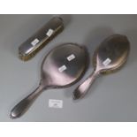 Three piece silver engine turned ladies vanity set comprising: hand mirror and two brushes. (B.P.