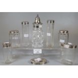 Collection of Edwardian silver topped and glass dressing table jars together with a silver topped