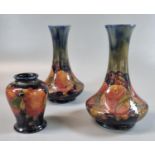 Pair of early 20th Century Moorcroft tube lined vases in the 'Pomegranate' pattern. 16cm high