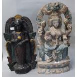 Black stained and gilt highlighted carved wooden figure of Bodhisattva, standing on a lotus