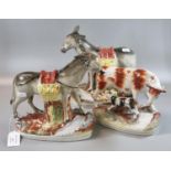 Pair of late 19th Century Staffordshire pottery donkeys carrying baskets of fruit on naturalistic