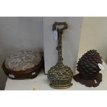 Two cast metal doorstops in the form of a basket of fruit and a pineapple, together with a Victorian