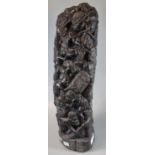 Tribal hardwood carved sculpture of repeating tribal figures, appearing at work. (B.P. 21% + VAT)