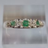 9ct gold green and white stone dress ring. 2g approx. Size Q1/2. (B.P. 21% + VAT)