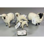 Beswick model of a ram and a Beswick sheep. Together with two ceramic lambs. (4) (B.P. 21% + VAT)